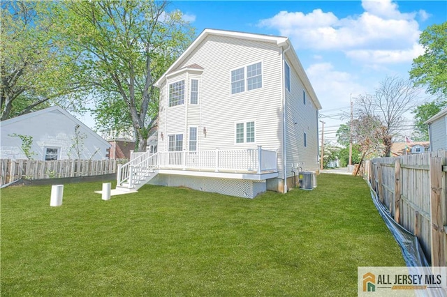 back of house featuring a wooden deck, central AC unit, and stairs