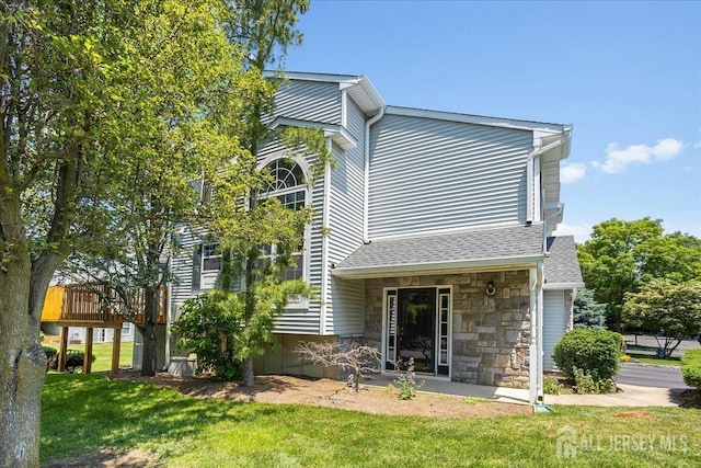 24 Hanna Ln, Old Bridge, NJ 08879 - back of house featuring a yard and a shingled roof