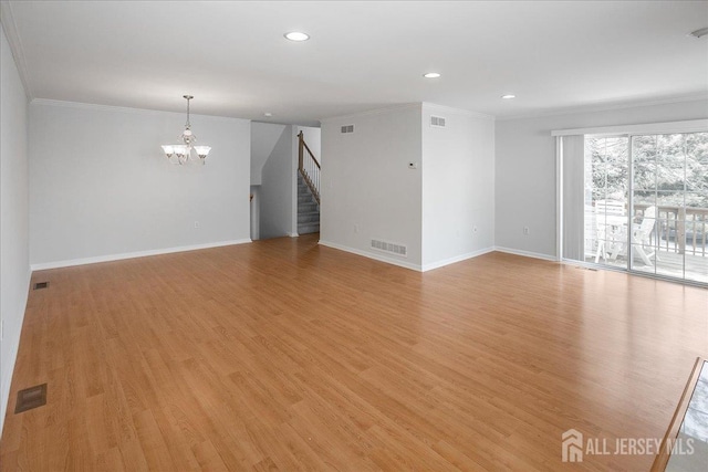 24 Hanna Ln, Old Bridge, NJ 08879 - spare room featuring a chandelier, stairway, crown molding, light wood-style flooring, and recessed lighting