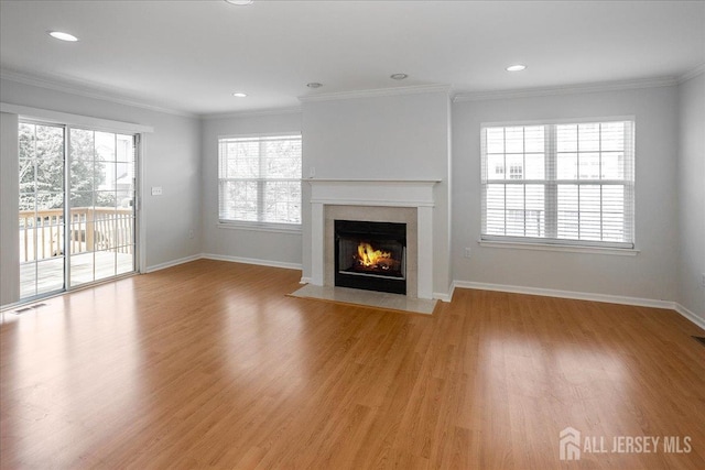 24 Hanna Ln, Old Bridge, NJ 08879 - unfurnished living room with a fireplace with flush hearth, light wood finished floors, crown molding, and recessed lighting