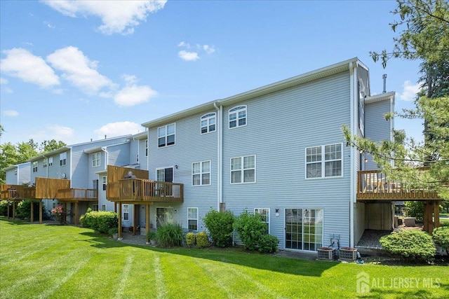24 Hanna Ln, Old Bridge, NJ 08879 - rear view of property featuring a yard and a deck