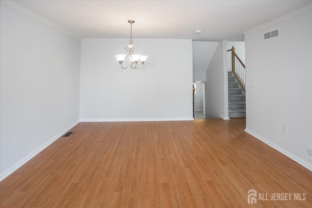 24 Hanna Ln, Old Bridge, NJ 08879 - spare room with a chandelier, stairs, light wood-type flooring, and crown molding