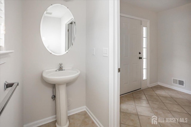 24 Hanna Ln, Old Bridge, NJ 08879 - bathroom with tile patterned flooring and baseboards