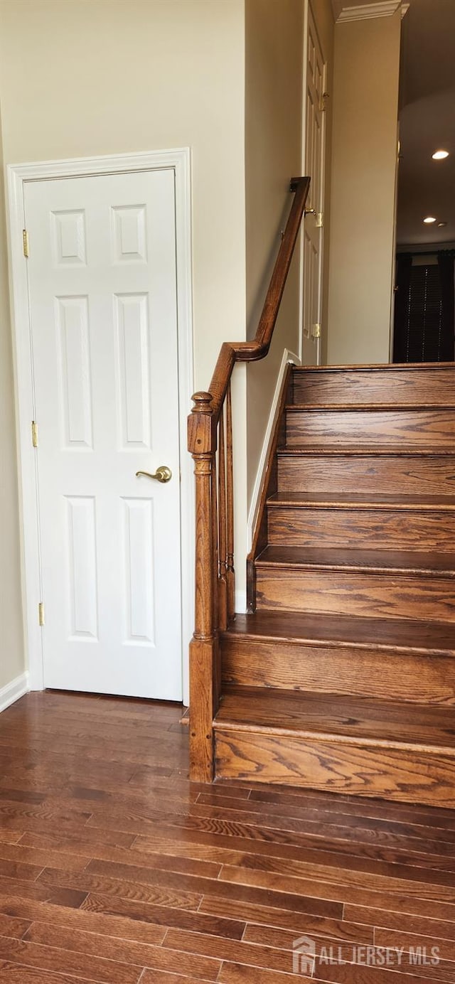 stairway with wood-type flooring