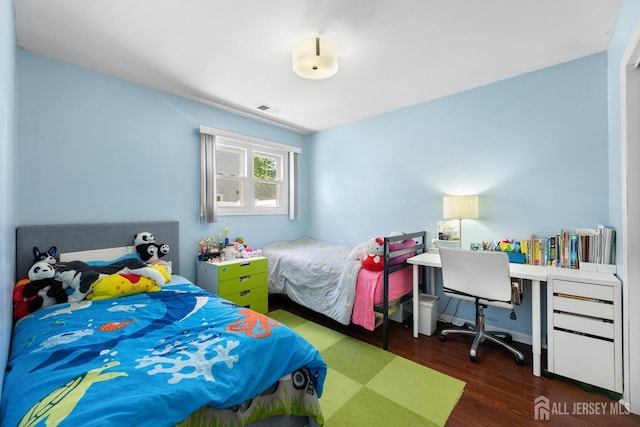 bedroom with wood finished floors
