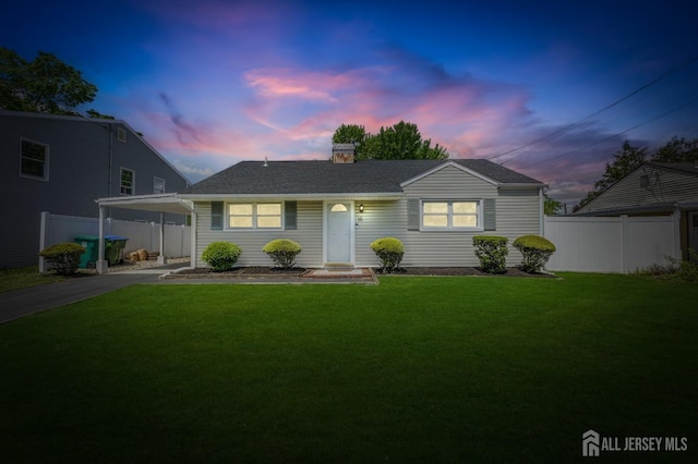 single story home featuring an attached carport, a chimney, asphalt driveway, and roof with shingles