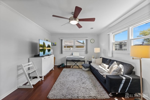 living area with crown molding, dark wood-style floors, ceiling fan, and baseboards
