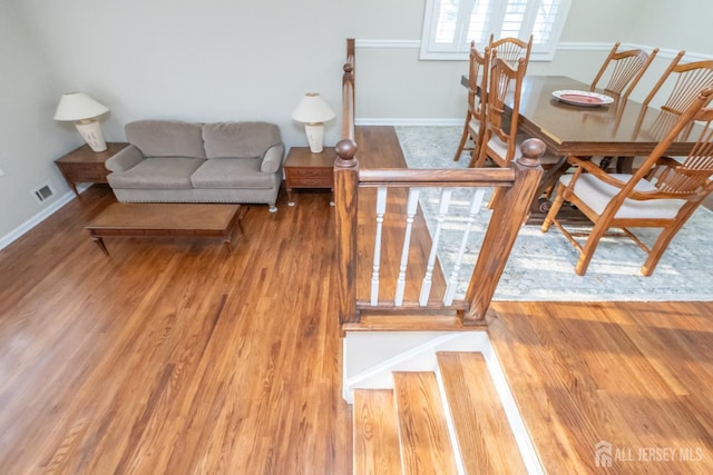 dining area with wood-type flooring