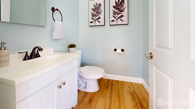 15-A Avenue B, Helmetta, NJ 08828 - half bath with wood finished floors, toilet, baseboards, and vanity