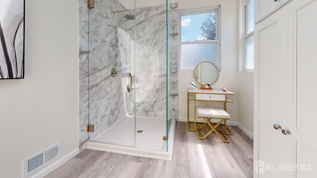 15-A Avenue B, Helmetta, NJ 08828 - bathroom featuring wood finished floors, a marble finish shower, and baseboards