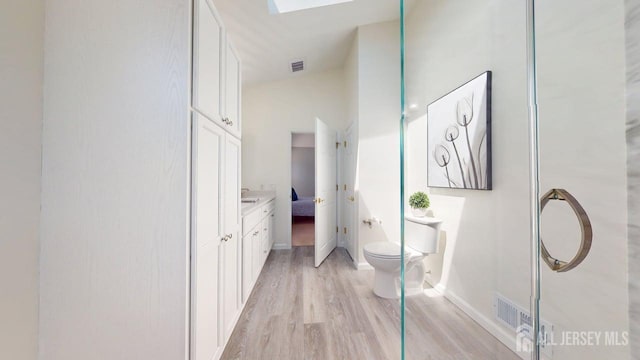 15-A Avenue B, Helmetta, NJ 08828 - bathroom with toilet, wood finished floors, ensuite bathroom, vanity, and baseboards