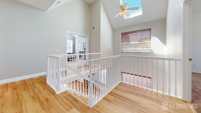 15-A Avenue B, Helmetta, NJ 08828 - stairway featuring wood finished floors, a skylight, high vaulted ceiling, ceiling fan, and baseboards