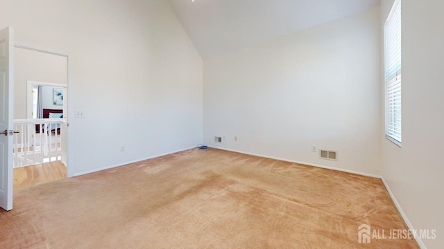 15-A Avenue B, Helmetta, NJ 08828 - carpeted empty room featuring high vaulted ceiling and baseboards