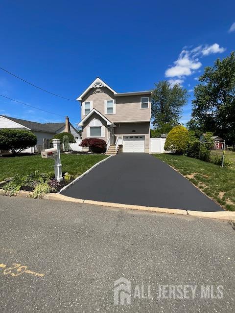 15-A Avenue B, Helmetta, NJ 08828 - view of front facade with a garage and asphalt driveway