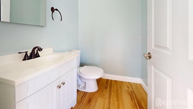 15-A Avenue B, Helmetta, NJ 08828 - half bath featuring wood finished floors, vanity, toilet, and baseboards