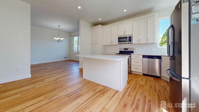 15-A Avenue B, Helmetta, NJ 08828 - kitchen with stainless steel appliances, white cabinets, light wood finished floors, light countertops, and recessed lighting