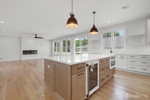 9 Links Dr, Edison, NJ 08820 - kitchen with beverage cooler, open shelves, plenty of natural light, and recessed lighting