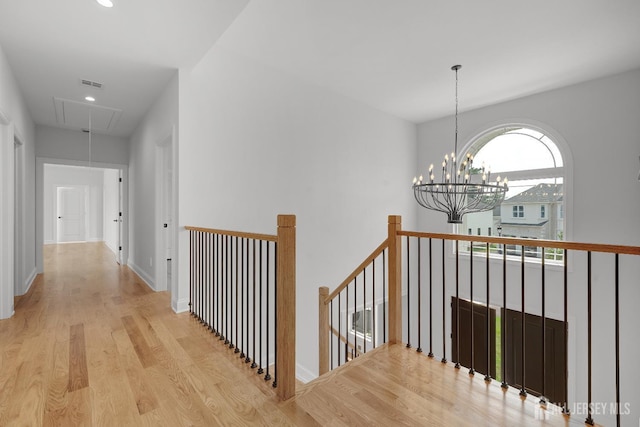 9 Links Dr, Edison, NJ 08820 - hall with attic access, an upstairs landing, wood finished floors, recessed lighting, and a chandelier
