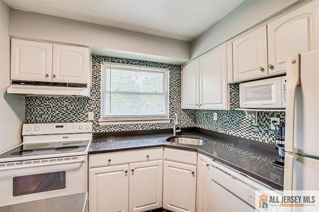 530 Andria Ave Unit 295, Hillsborough, NJ 08844 - kitchen with white appliances, under cabinet range hood, dark countertops, white cabinetry, and tasteful backsplash
