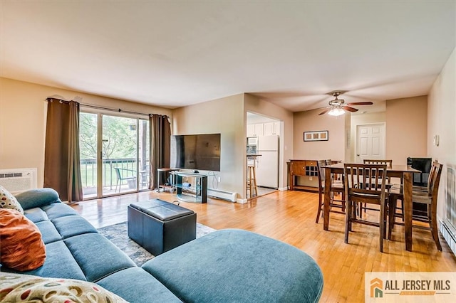 530 Andria Ave Unit 295, Hillsborough, NJ 08844 - living area featuring a baseboard heating unit, light wood-style floors, and a ceiling fan
