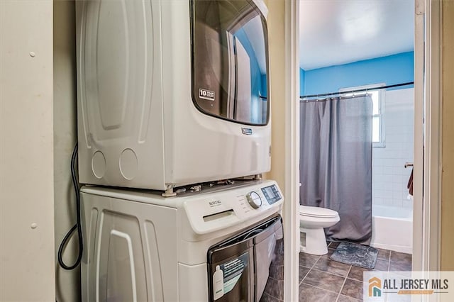 530 Andria Ave Unit 295, Hillsborough, NJ 08844 - full bathroom featuring estacked washer and dryer, shower / tub combo with curtain, and tile patterned floors