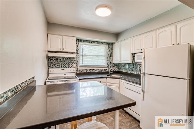 530 Andria Ave Unit 295, Hillsborough, NJ 08844 - kitchen with white appliances, dark countertops, white cabinets, and under cabinet range hood