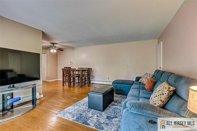 530 Andria Ave Unit 295, Hillsborough, NJ 08844 - living area featuring ceiling fan, a baseboard heating unit, and wood finished floors