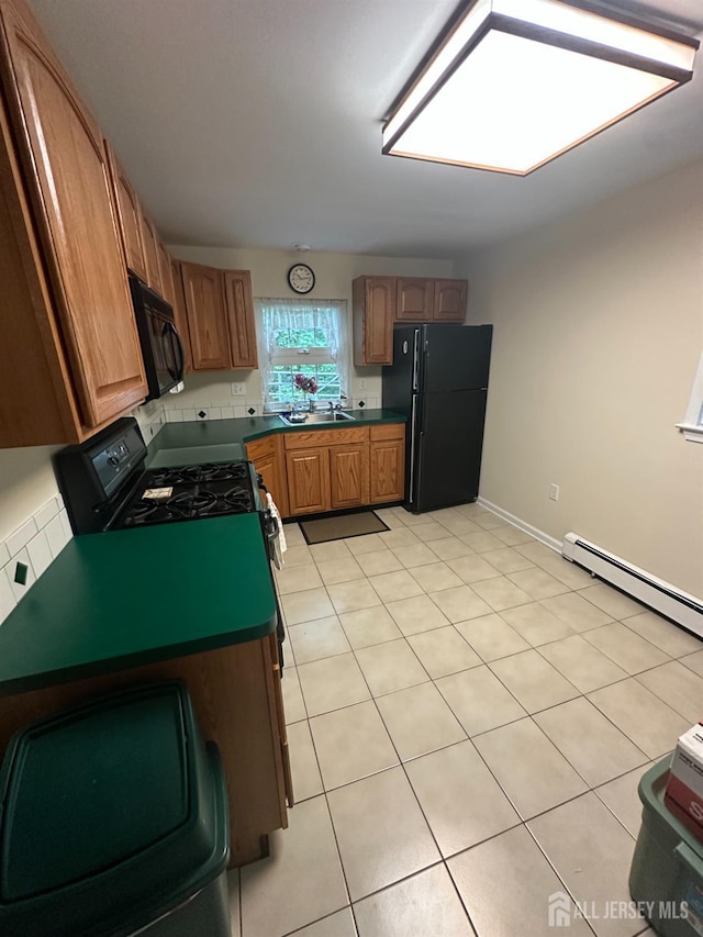 140 Bunker Hill Rd, Franklin Twsp, NJ 08540 - kitchen with black appliances, dark countertops, brown cabinets, and light tile patterned floors