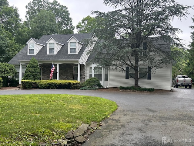 140 Bunker Hill Rd, Franklin Twsp, NJ 08540 - cape cod home featuring stone siding, curved driveway, a front lawn, and roof with shingles