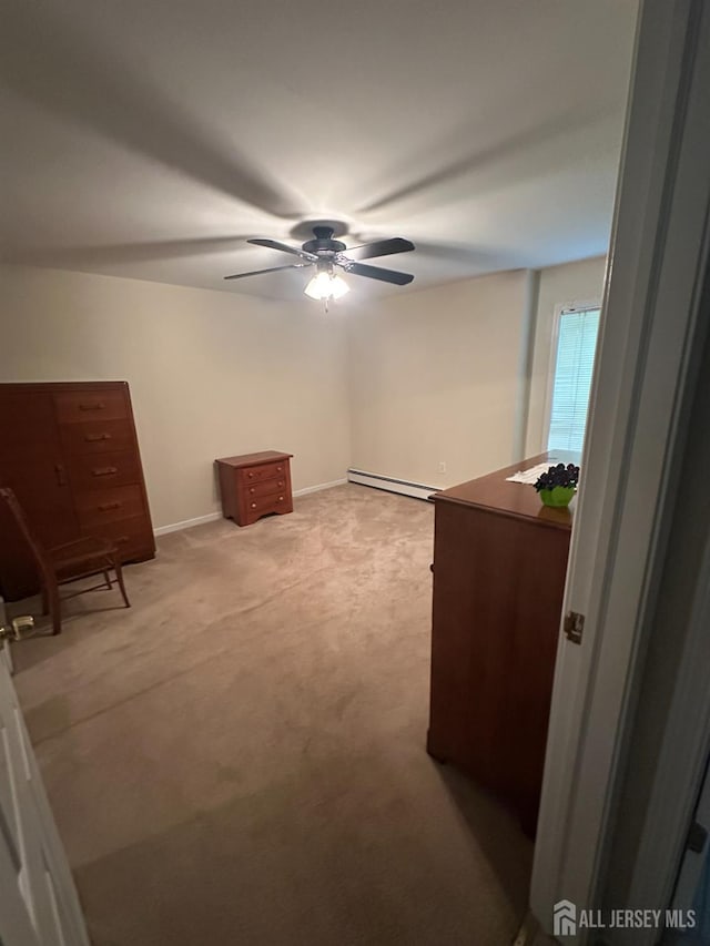 140 Bunker Hill Rd, Franklin Twsp, NJ 08540 - unfurnished bedroom featuring light colored carpet, a baseboard radiator, and ceiling fan