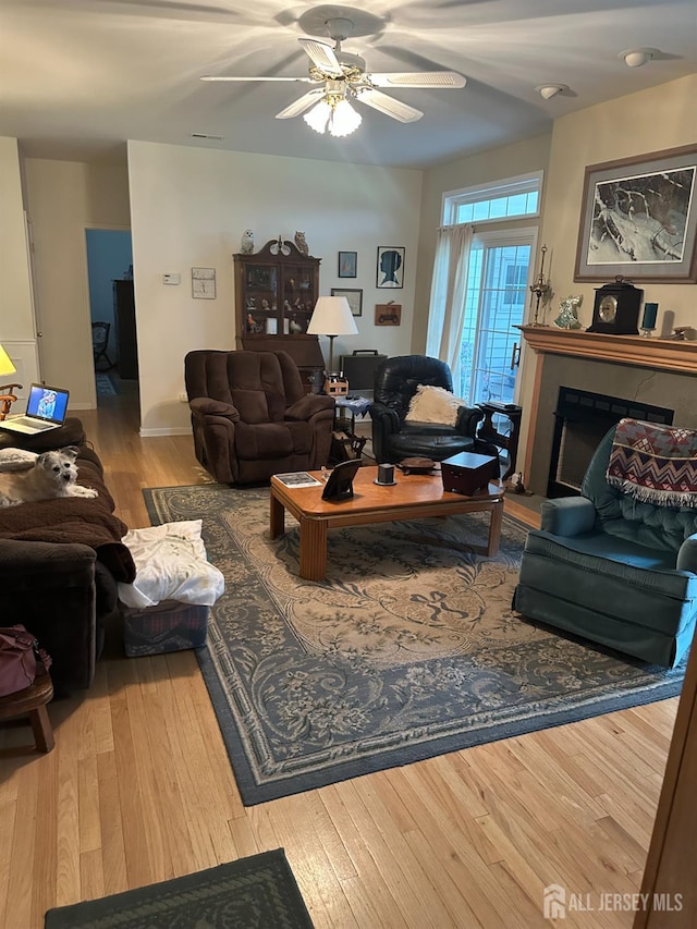 140 Bunker Hill Rd, Franklin Twsp, NJ 08540 - living room featuring wood-type flooring, a ceiling fan, and a fireplace