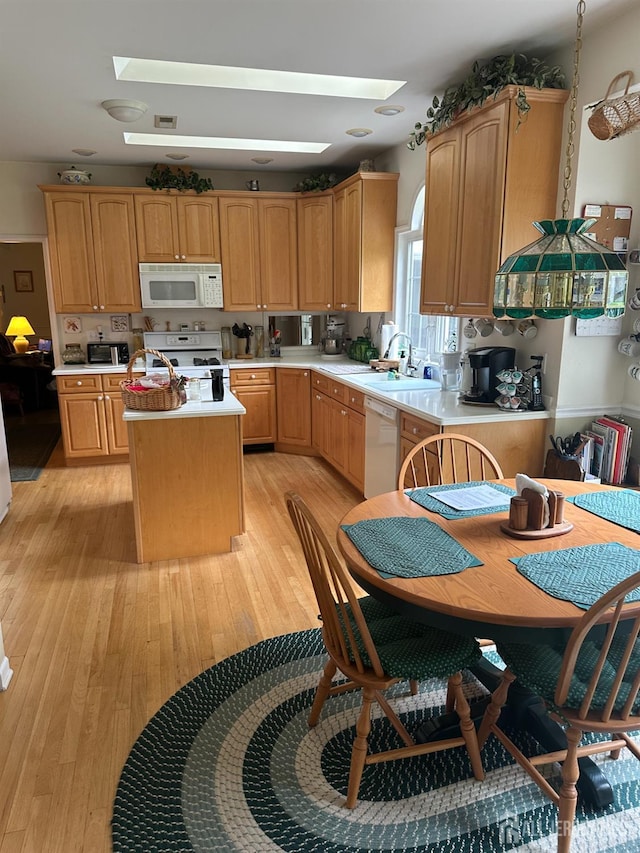 140 Bunker Hill Rd, Franklin Twsp, NJ 08540 - kitchen featuring white appliances, a kitchen island, light countertops, and light wood-type flooring