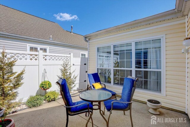 595 Waterside Blvd, Monroe, NJ 08831 - view of patio / terrace featuring fence