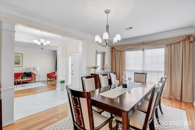 595 Waterside Blvd, Monroe, NJ 08831 - dining space featuring ornamental molding, ornate columns, a notable chandelier, and visible vents