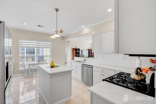 595 Waterside Blvd, Monroe, NJ 08831 - kitchen with stainless steel appliances, a center island, a sink, visible vents, and light countertops