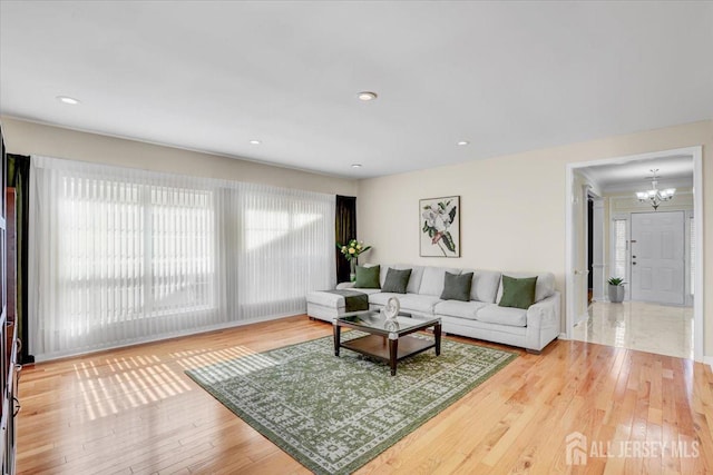 595 Waterside Blvd, Monroe, NJ 08831 - living room featuring wood-type flooring, a notable chandelier, and recessed lighting