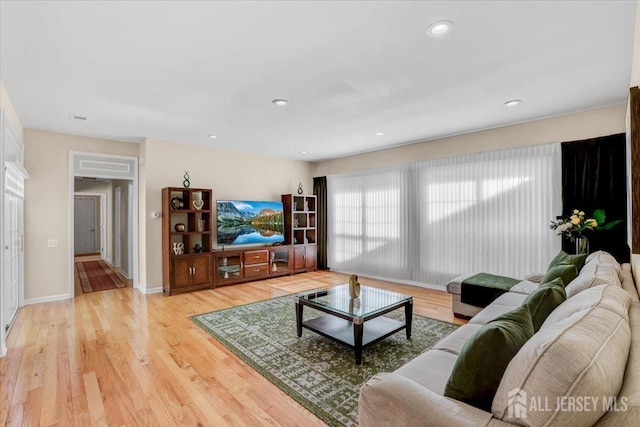 595 Waterside Blvd, Monroe, NJ 08831 - living area featuring light wood-type flooring and baseboards