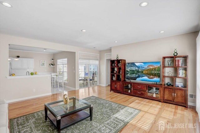 595 Waterside Blvd, Monroe, NJ 08831 - living room with recessed lighting, light wood-style floors, visible vents, and baseboards