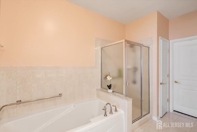 595 Waterside Blvd, Monroe, NJ 08831 - full bathroom featuring a bath, tile patterned flooring, and a shower stall
