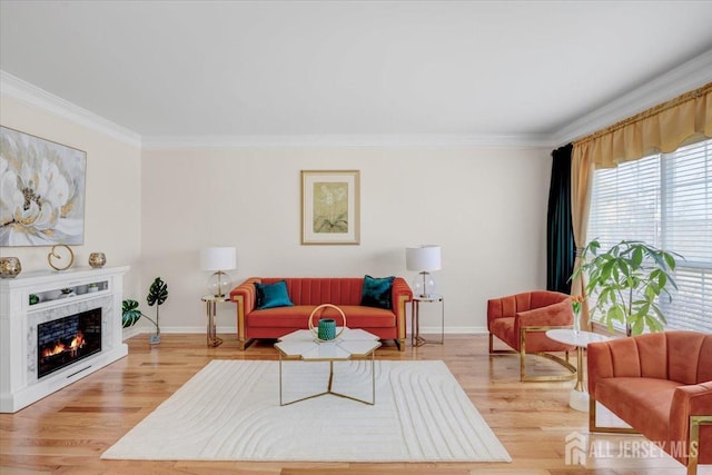 595 Waterside Blvd, Monroe, NJ 08831 - living area featuring wood finished floors, baseboards, and ornamental molding