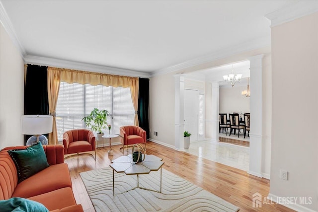 595 Waterside Blvd, Monroe, NJ 08831 - living area featuring a chandelier, plenty of natural light, crown molding, and decorative columns