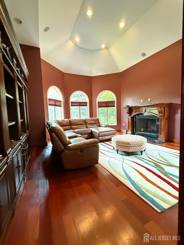 34 Line Rd, Holmdel, NJ 07733 - living room featuring wood finished floors, high vaulted ceiling, a glass covered fireplace, and recessed lighting