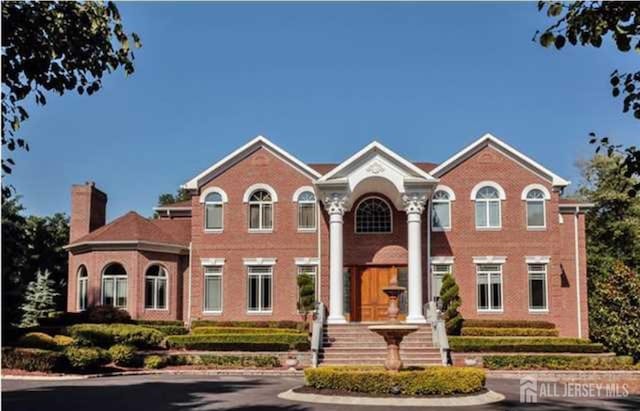 34 Line Rd, Holmdel, NJ 07733 - view of front facade with a chimney