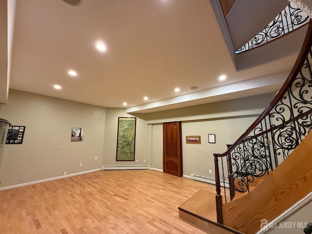 34 Line Rd, Holmdel, NJ 07733 - interior space featuring a baseboard heating unit, a baseboard radiator, recessed lighting, light wood-type flooring, and stairs