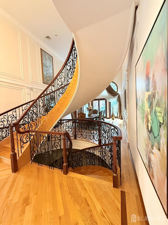 34 Line Rd, Holmdel, NJ 07733 - staircase with wood finished floors and a decorative wall