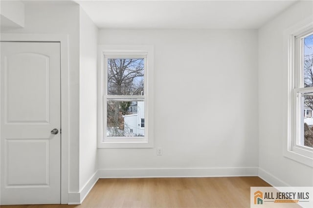 interior space with light wood-style flooring and baseboards