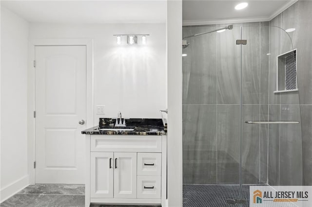 bathroom with a stall shower and vanity