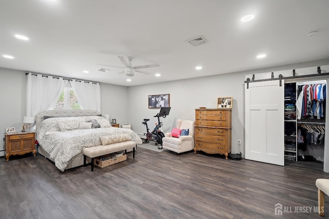 242 Green St, Old Bridge, NJ 08857 - bedroom featuring dark wood-style flooring, a barn door, recessed lighting, a ceiling fan, and a spacious closet