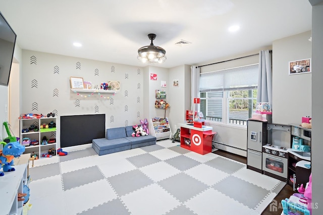 242 Green St, Old Bridge, NJ 08857 - playroom with a baseboard heating unit and recessed lighting