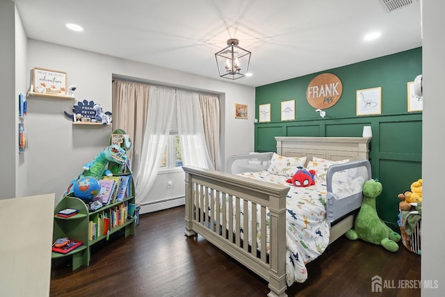 242 Green St, Old Bridge, NJ 08857 - bedroom featuring a baseboard radiator, recessed lighting, wood finished floors, a chandelier, and a decorative wall